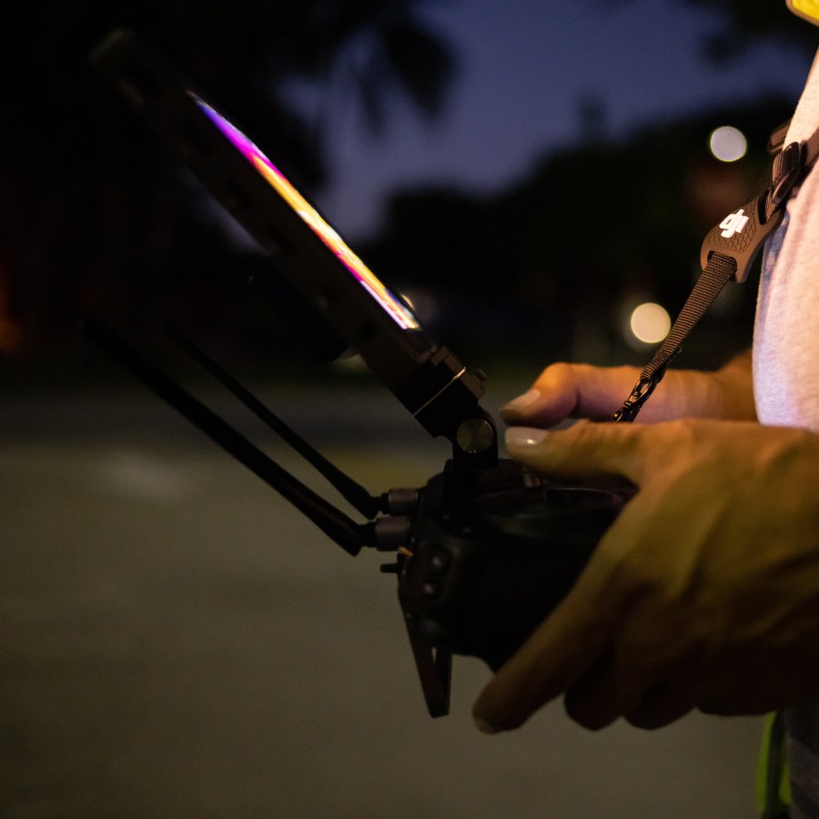 Sebastian operating a drone controller during an aerial mapping flight